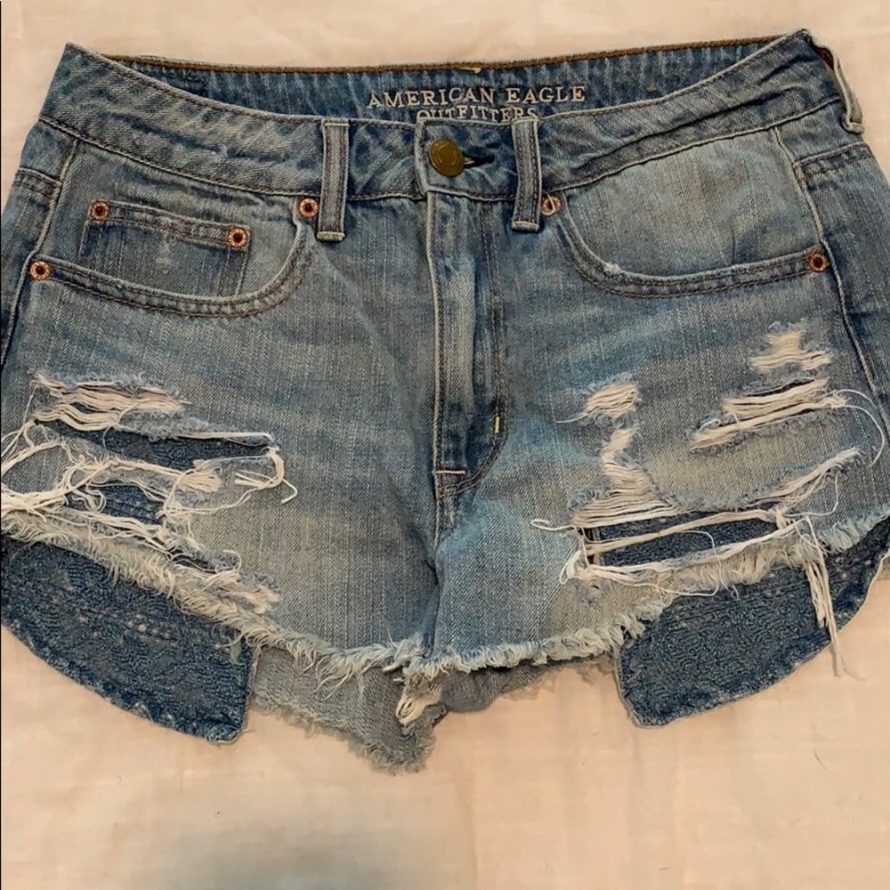 High-waisted, distressed, jean shorts.